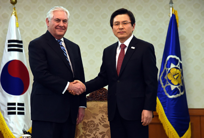 South Korea's Acting President and Prime Minister Hwang Kyo-ahn shakes hands with U.S. Secretary of State Rex Tillerson before their talks in Hwang's office in Seoul on March 17, 2017.